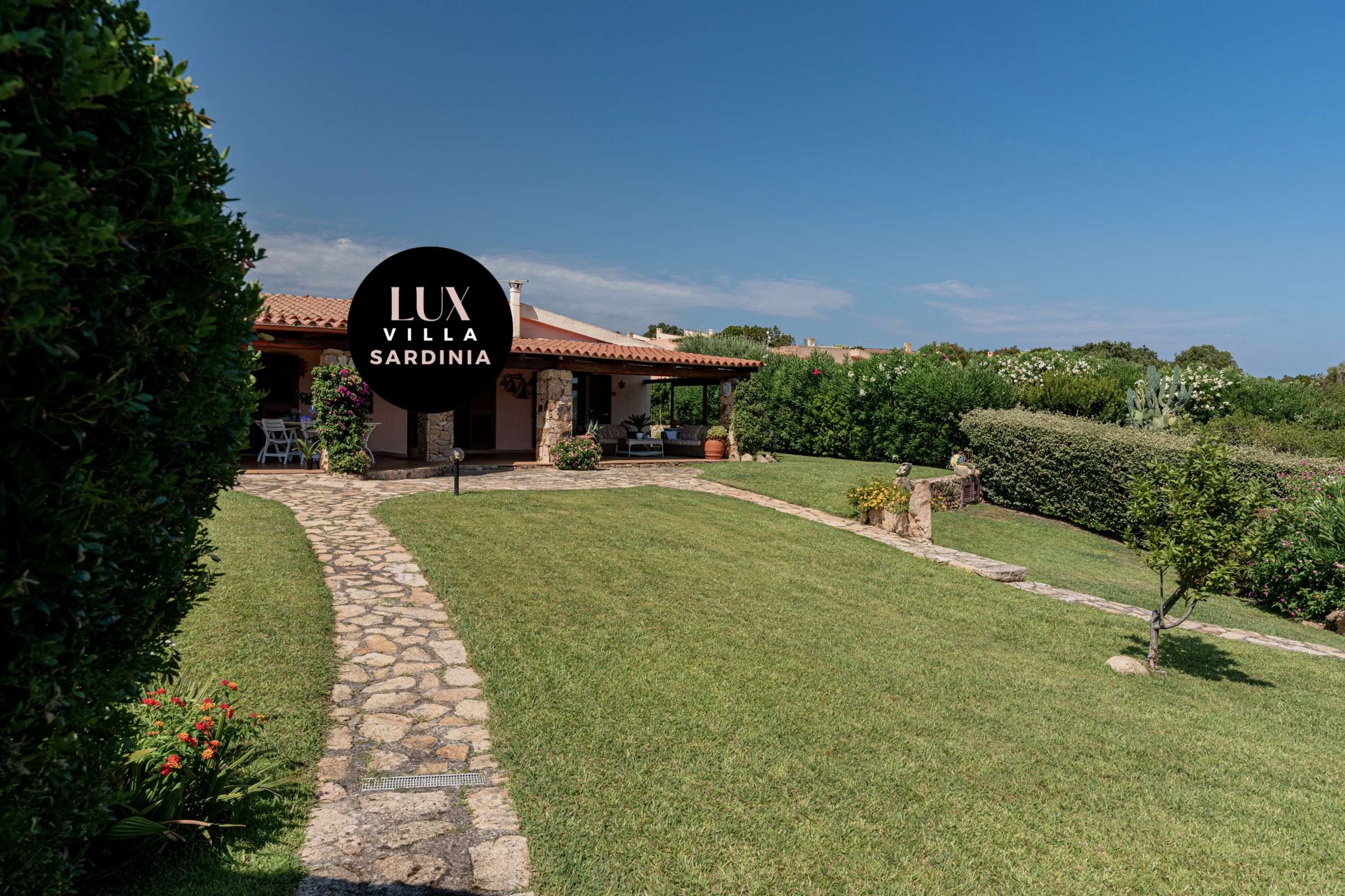 8 of 66. Discover a unique villa in Sardinia surrounded by lush gardens and stunning panoramic views.