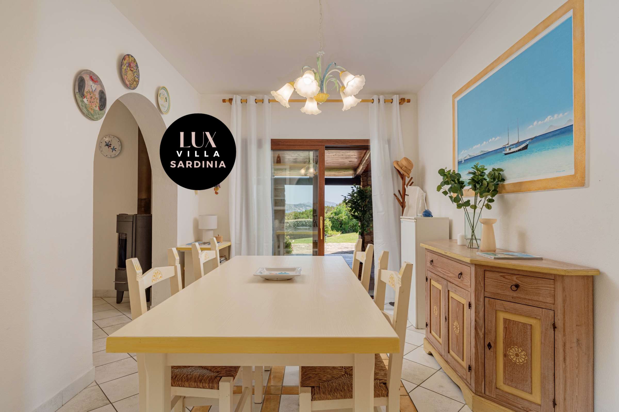 35 of 66. Bright and inviting dining space with scenic views, featuring a spacious table perfect for gatherings.