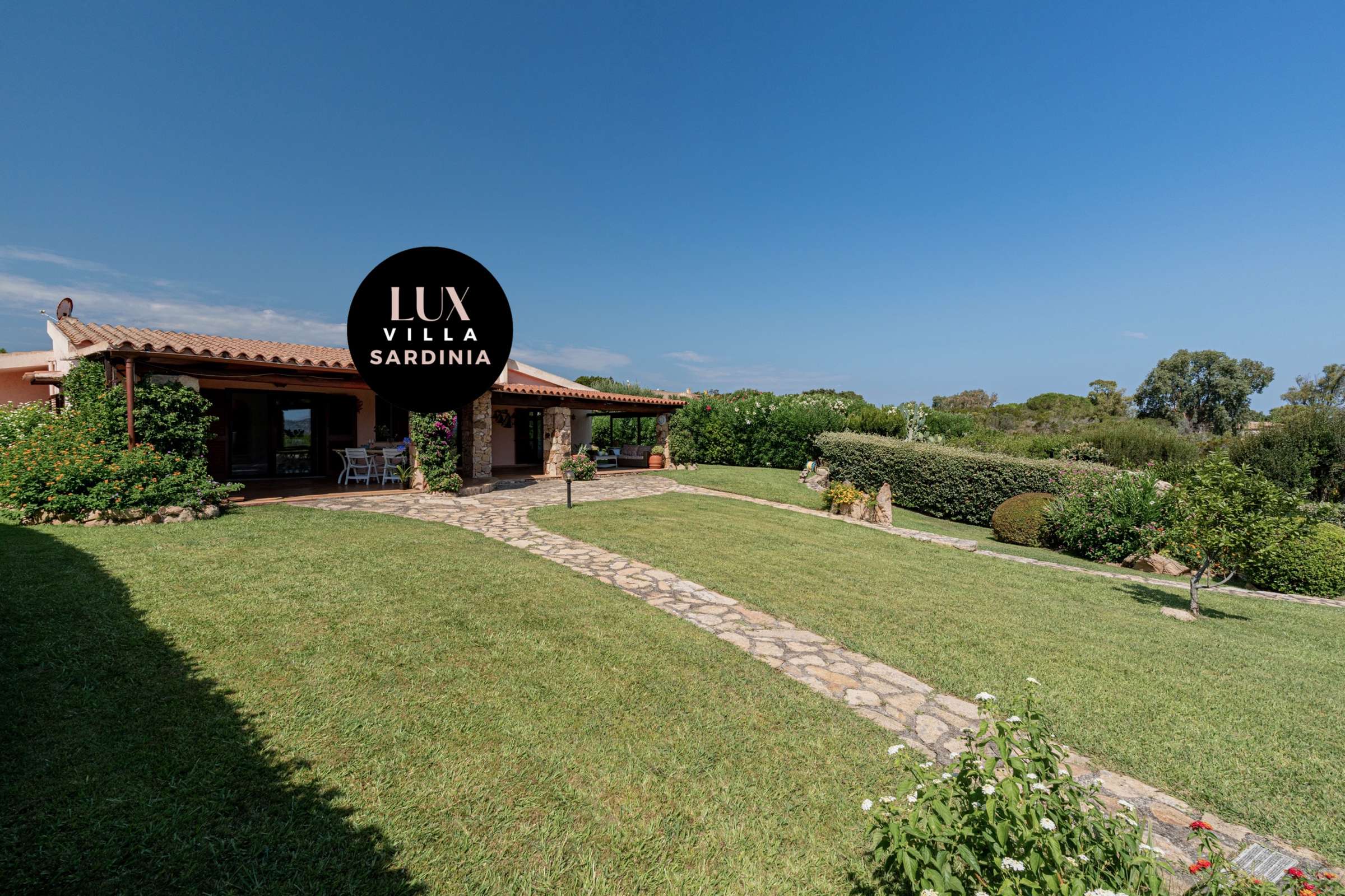 10 of 66. Discover this inviting villa in Sardinia, featuring expansive gardens and stunning outdoor spaces perfect for relaxation.
