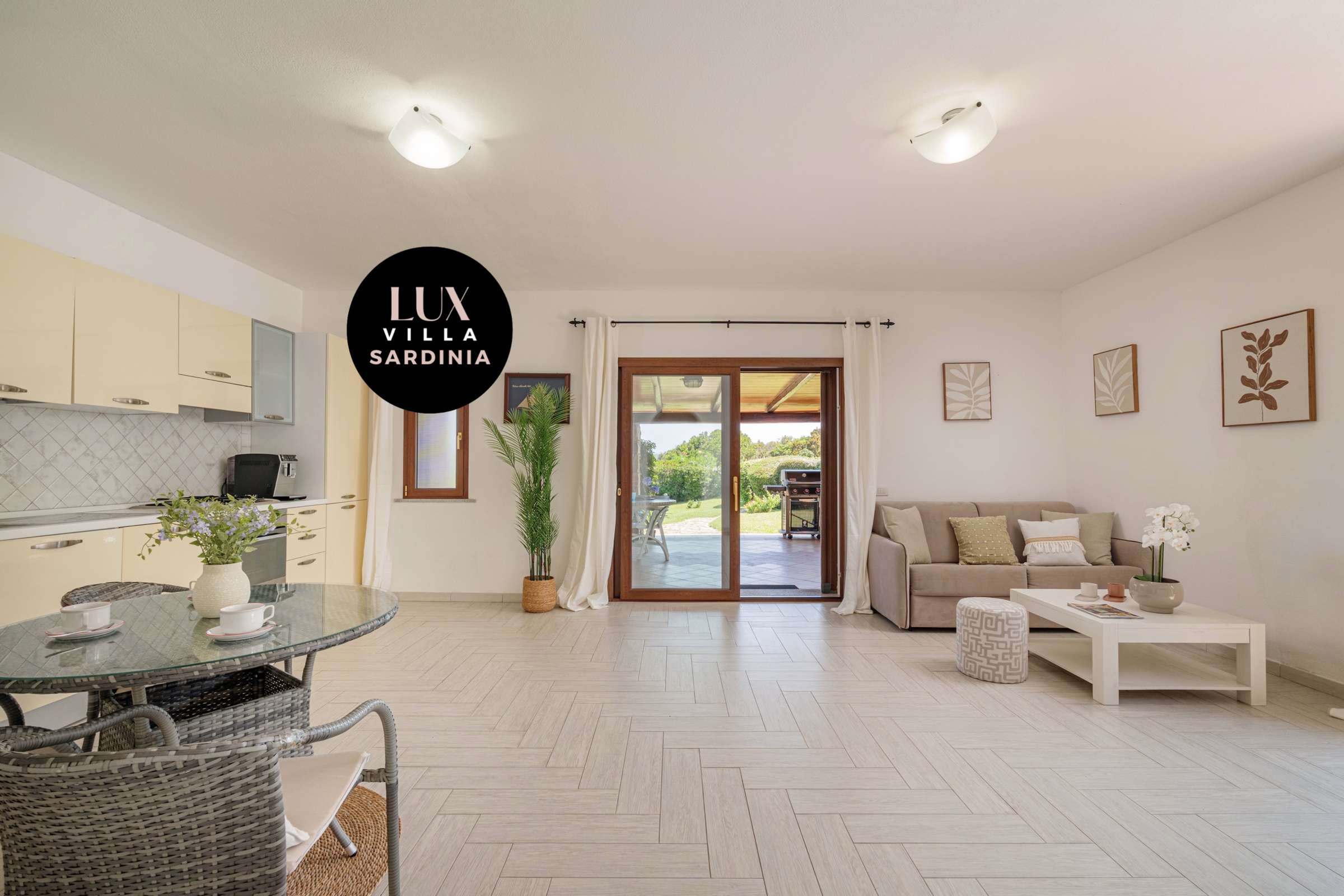 23 of 66. Spacious open-plan living area seamlessly connects to a sunlit patio with captivating garden views.