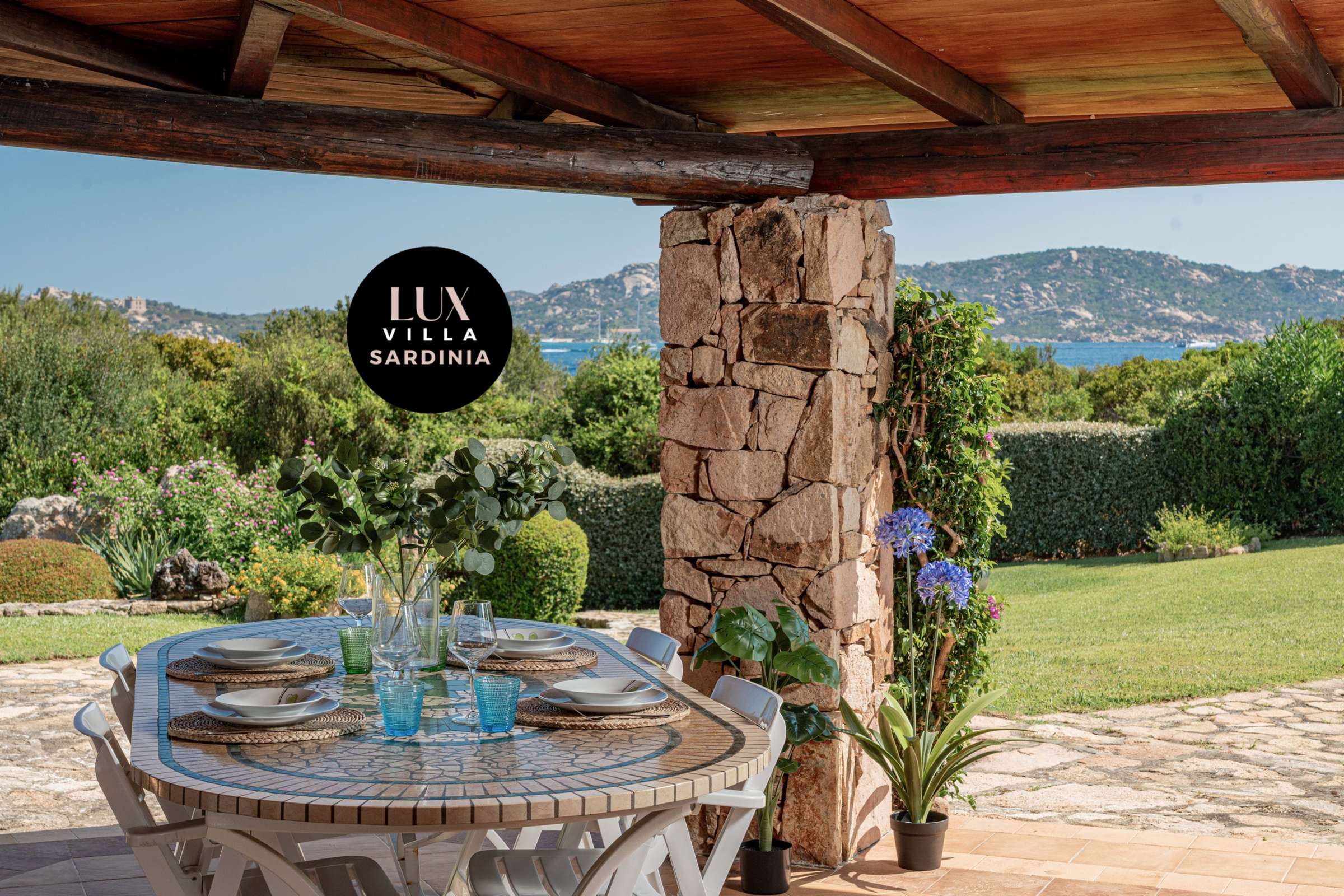 19 of 66. Experience outdoor dining with stunning views of the lush landscape and coastline in this inviting villa.