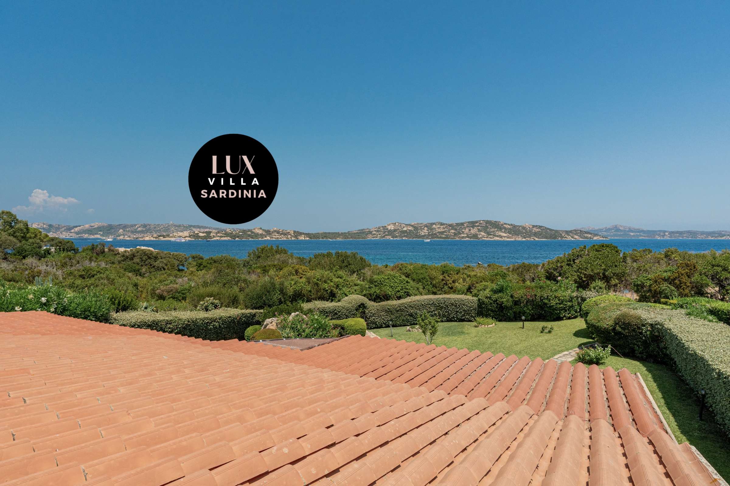 53 of 66. Stunning villa offers breathtaking sea views and expansive outdoor spaces surrounded by lush greenery.