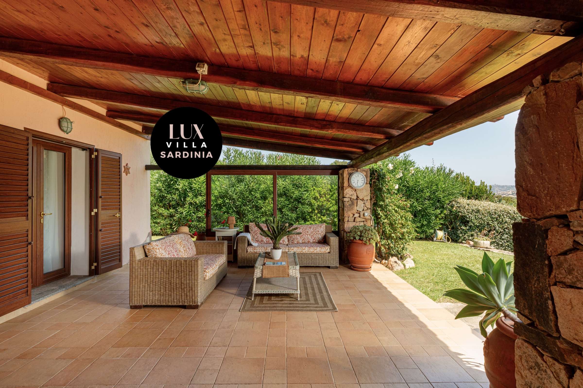 13 of 66. Spacious outdoor patio with lush greenery, perfect for relaxing and entertaining in a vibrant setting.