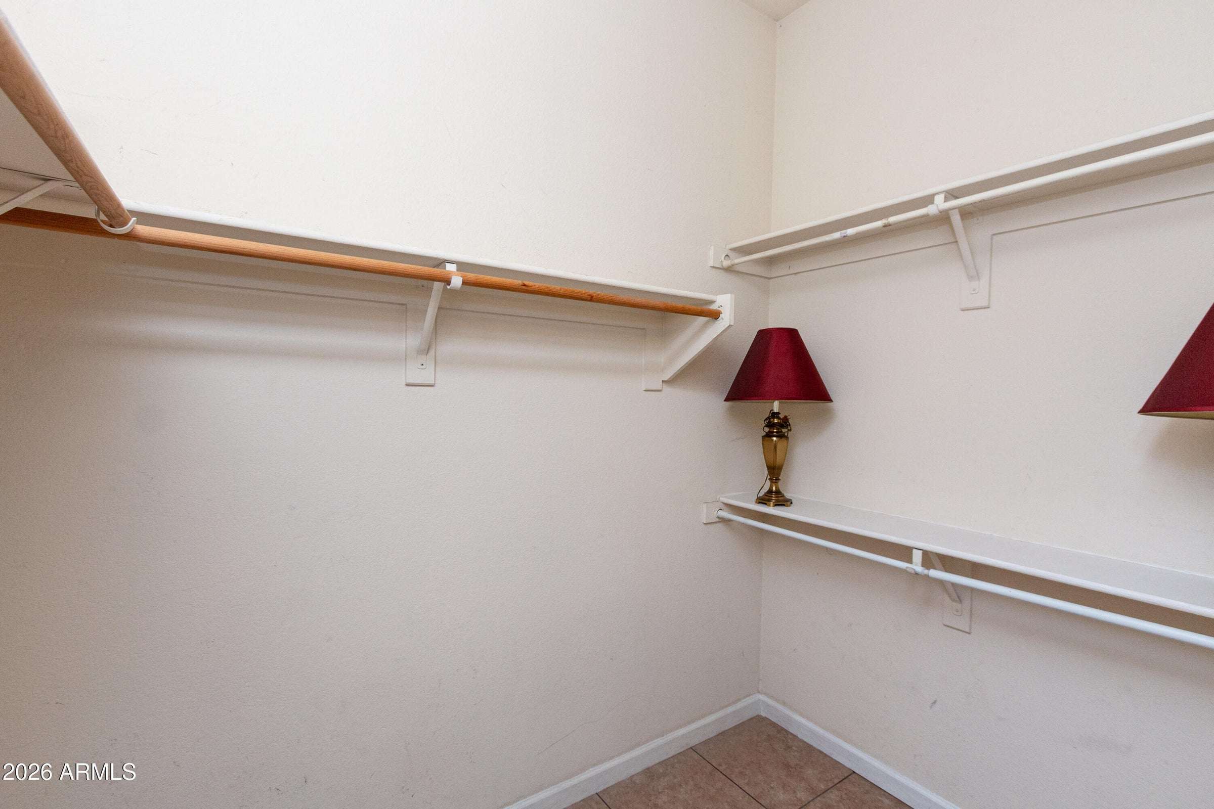 18 of 29. Large walk-in closet with extensive storage and organization potential. A highly desirable feature that complements the spacious primary suite.