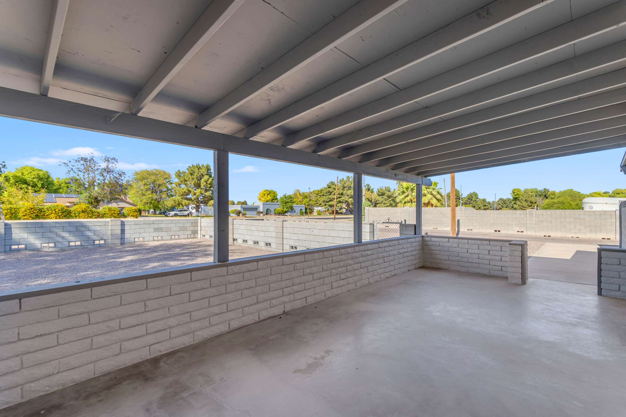 7 of 43. Covered front porch creates a welcoming entrance and comfortable outdoor sitting area overlooking the spacious front yard, offering the perfect place to relax throughout the year.
