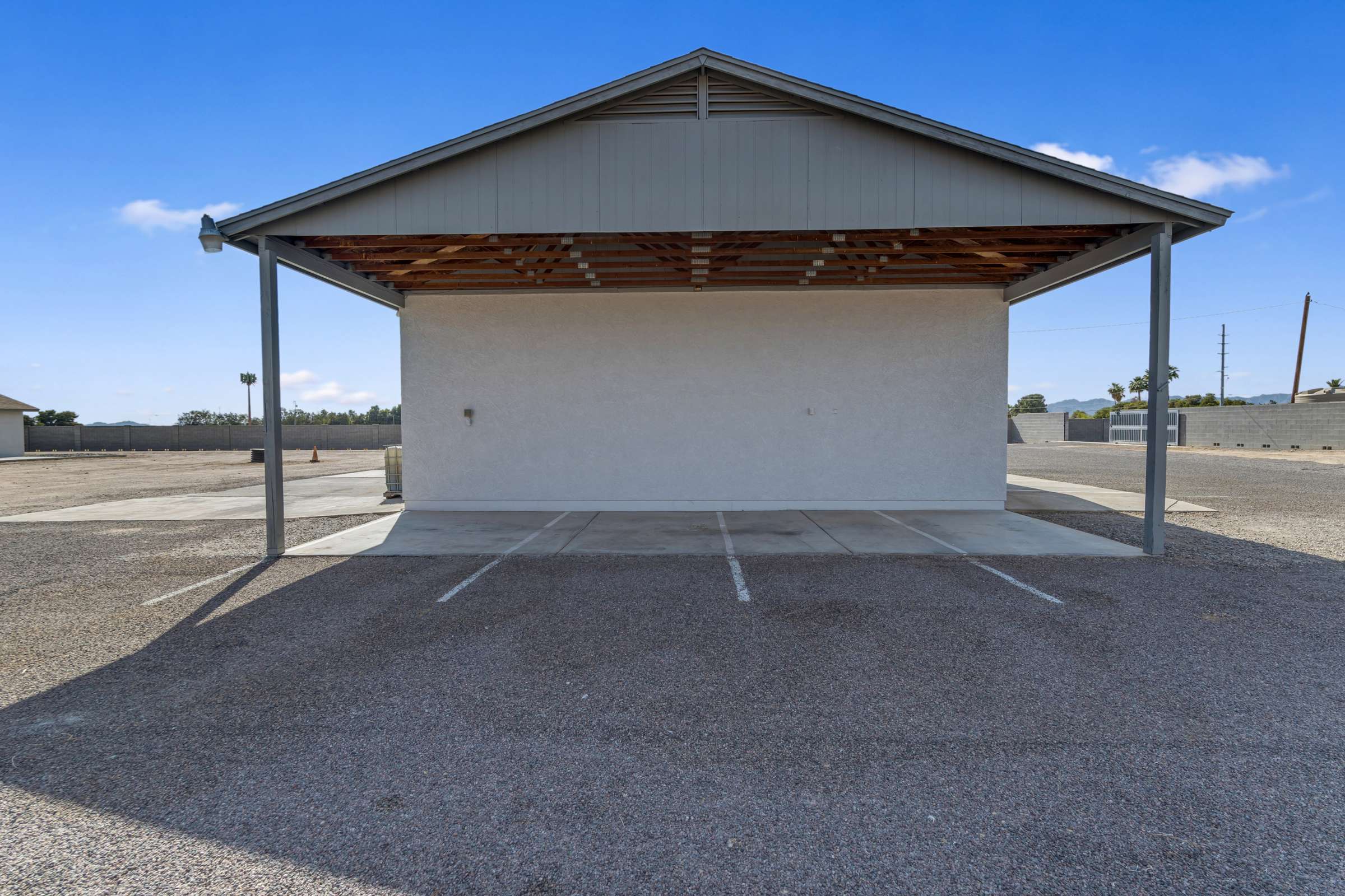 11 of 43. Covered parking area provides dedicated space for RVs, trailers, work vehicles, or additional parking. Combined with the oversized lot, this property offers exceptional flexibility for storage and recreation.