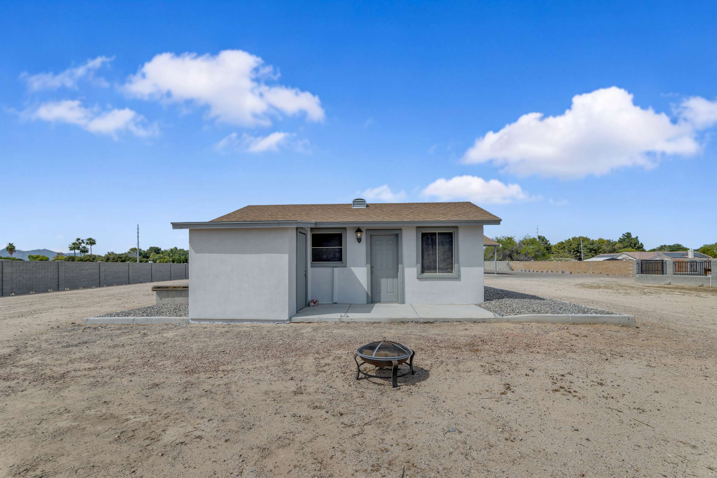 13 of 43. Exterior view of the detached casita showcases its private entrance and separate living quarters, providing an excellent option for guests, rental potential, or a home office.