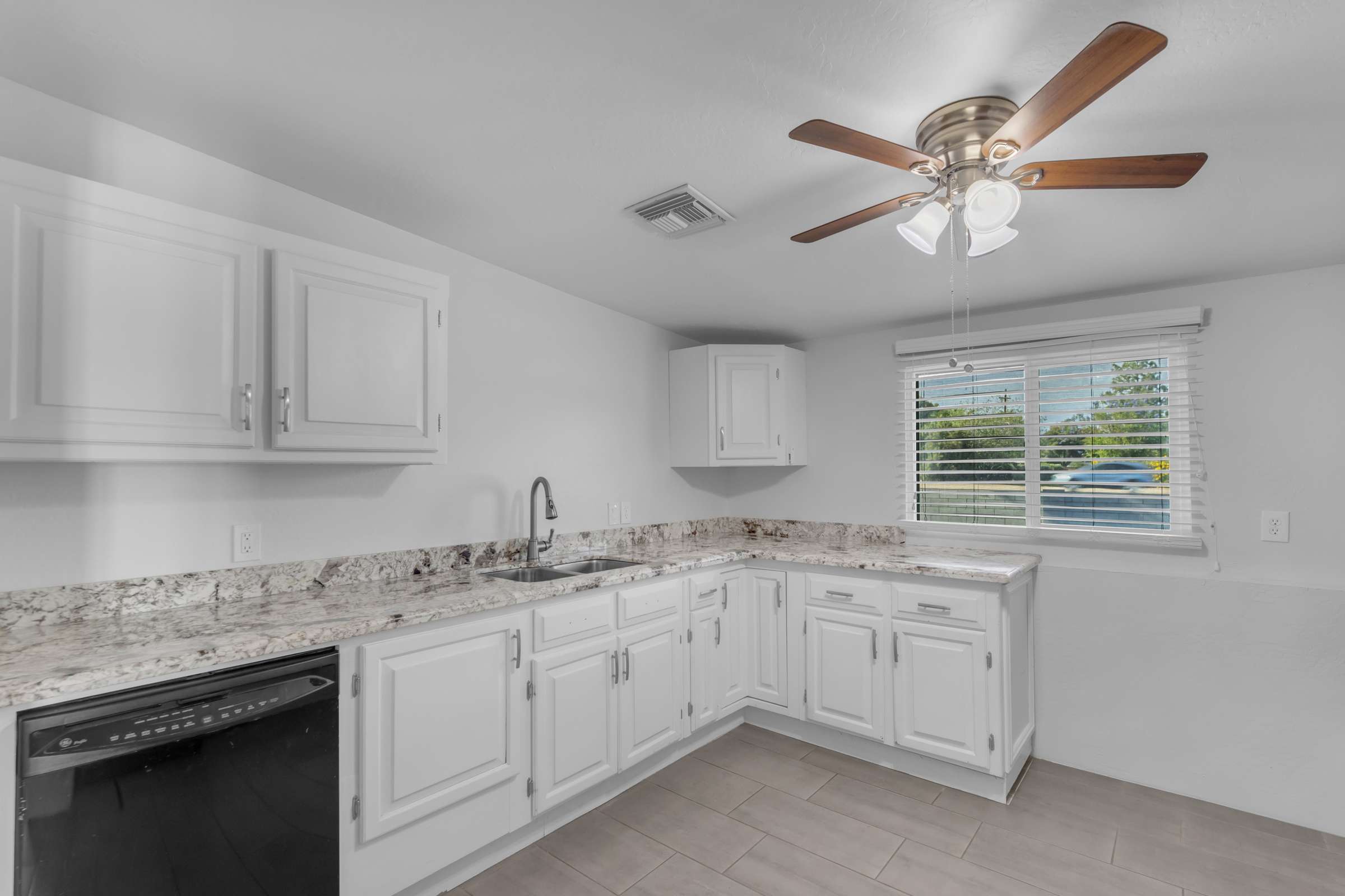 22 of 43. Spacious kitchen highlights granite countertops, abundant cabinetry, stainless steel appliances, and plenty of natural light, providing both style and functionality for daily living.