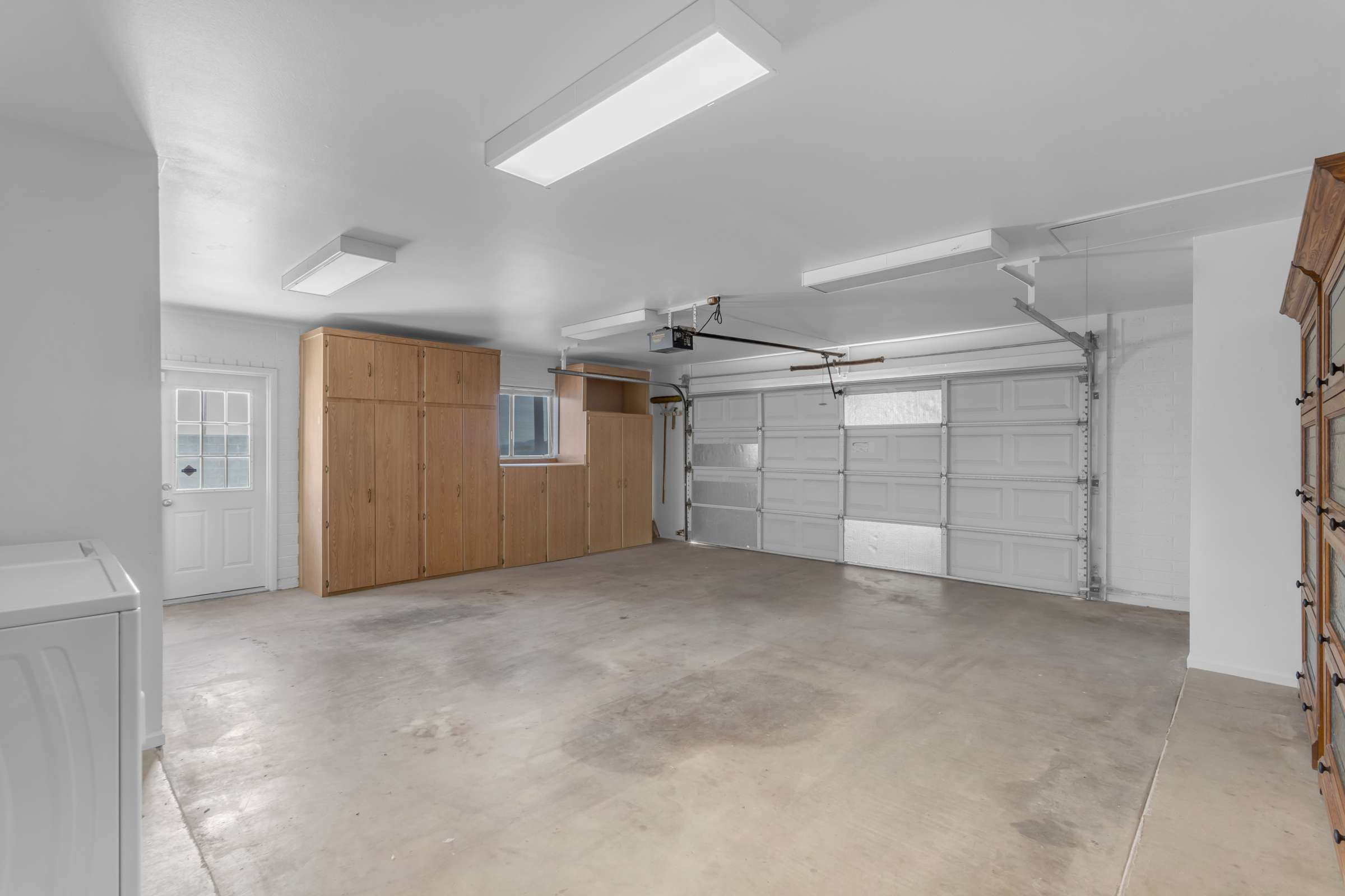 37 of 43. Large two-car garage provides abundant built-in storage cabinets, workspace, and parking flexibility, making organization easy for everyday living.