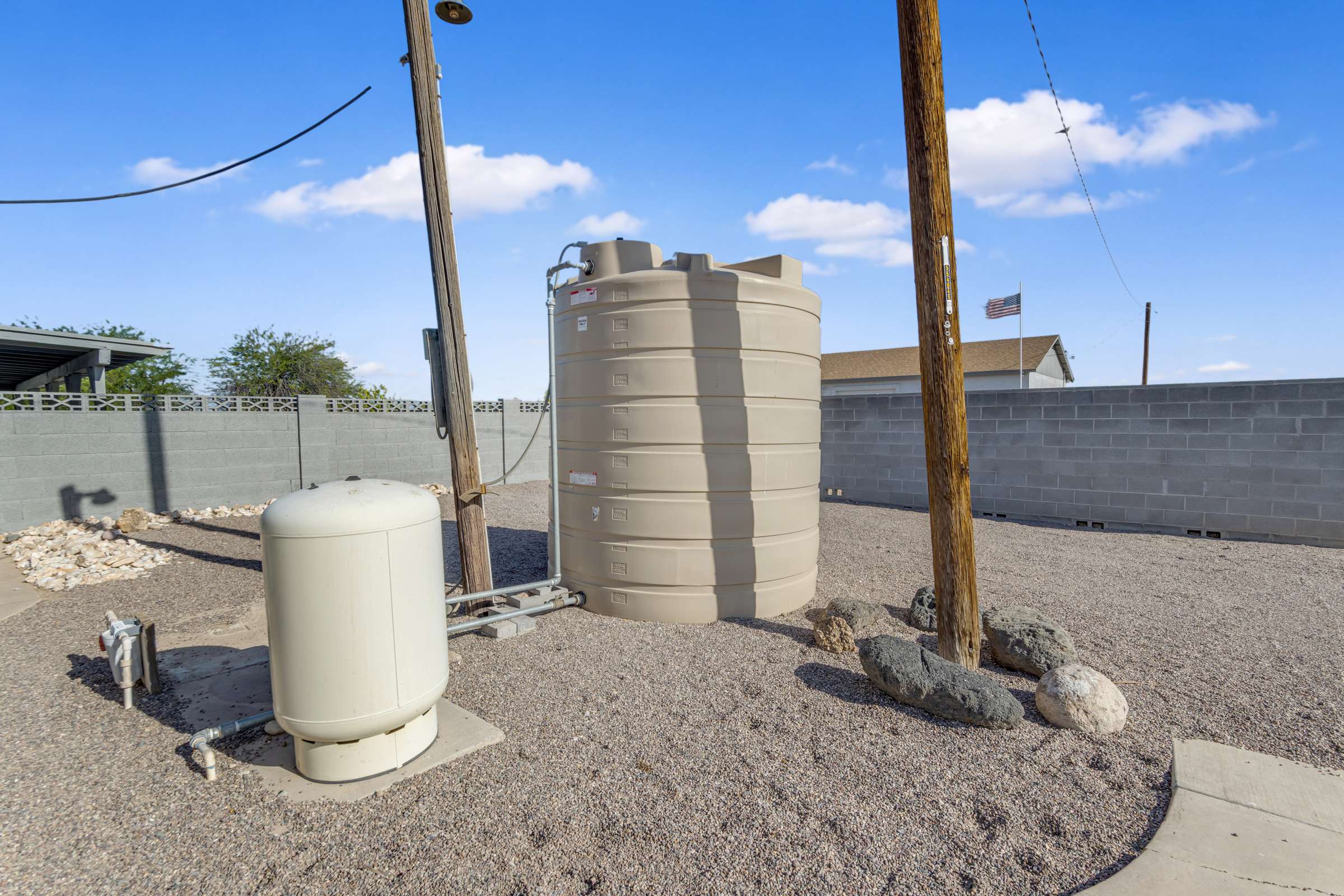 39 of 43. Private well and water storage system add convenience and support the property's outdoor functionality, complementing the spacious yard and practical amenities.