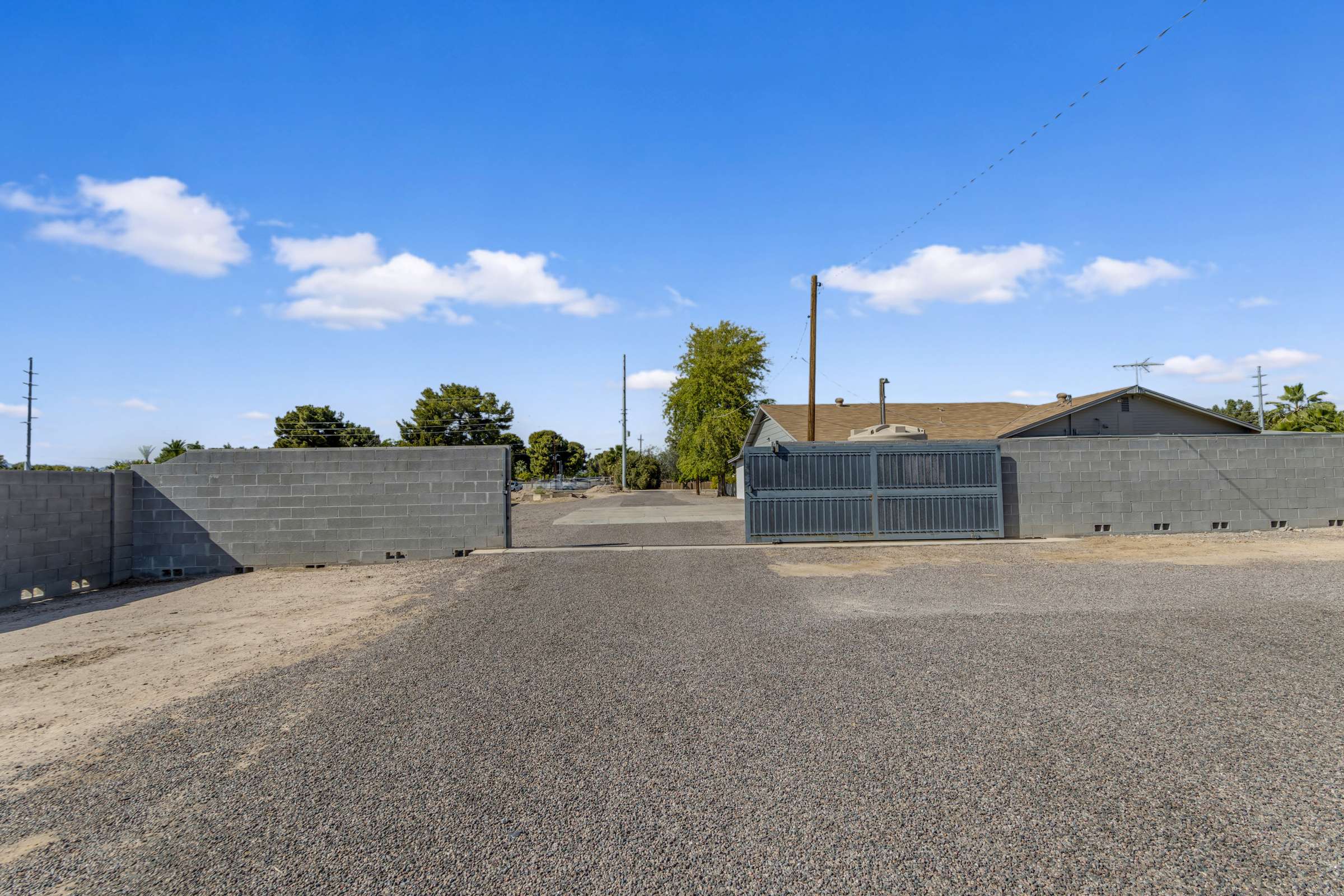 40 of 43. Wide gated rear access offers convenient entry for RVs, trailers, recreational equipment, or extra vehicles while enhancing the flexibility and usability of this Goodyear property.