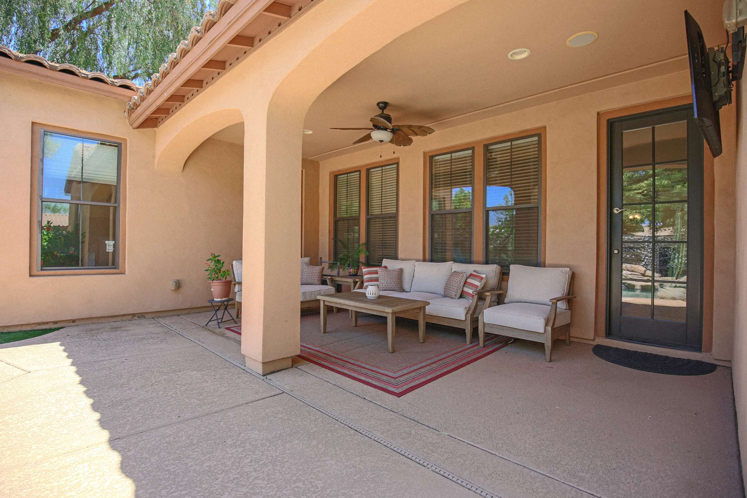65 of 72. A private putting green adds recreation to the resort-inspired backyard, complemented by a custom pool, raised spa, mature landscaping, and peaceful outdoor living spaces.