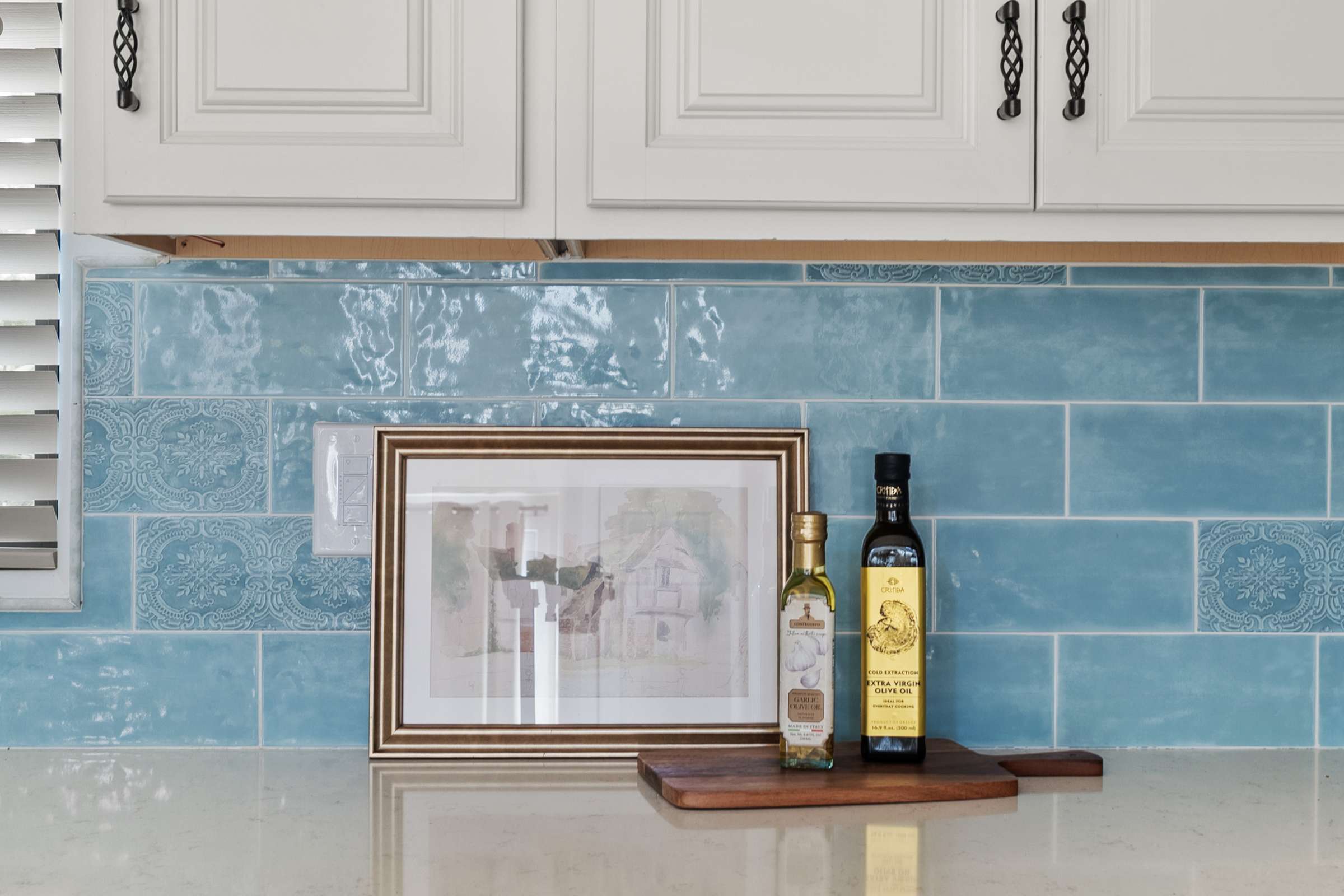 22 of 72. Premium quartz counters, abundant cabinetry, and a handcrafted tile backsplash highlight the upscale finishes found throughout this gourmet kitchen, offering both beauty and everyday functionality.