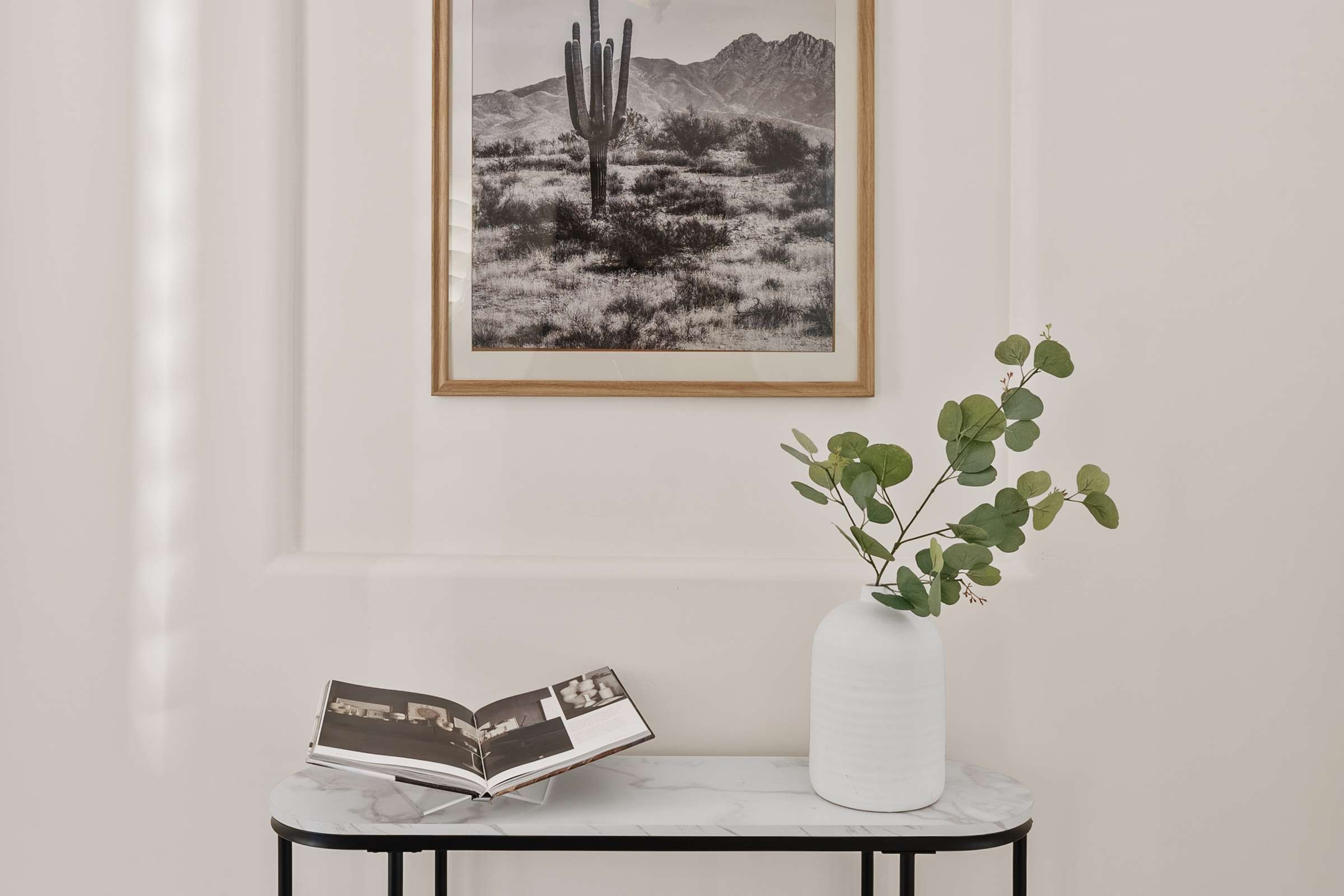 27 of 72. A decorative foyer niche adds architectural charm and visual appeal, enhancing the welcoming entrance and elegant design found throughout this Scottsdale residence.