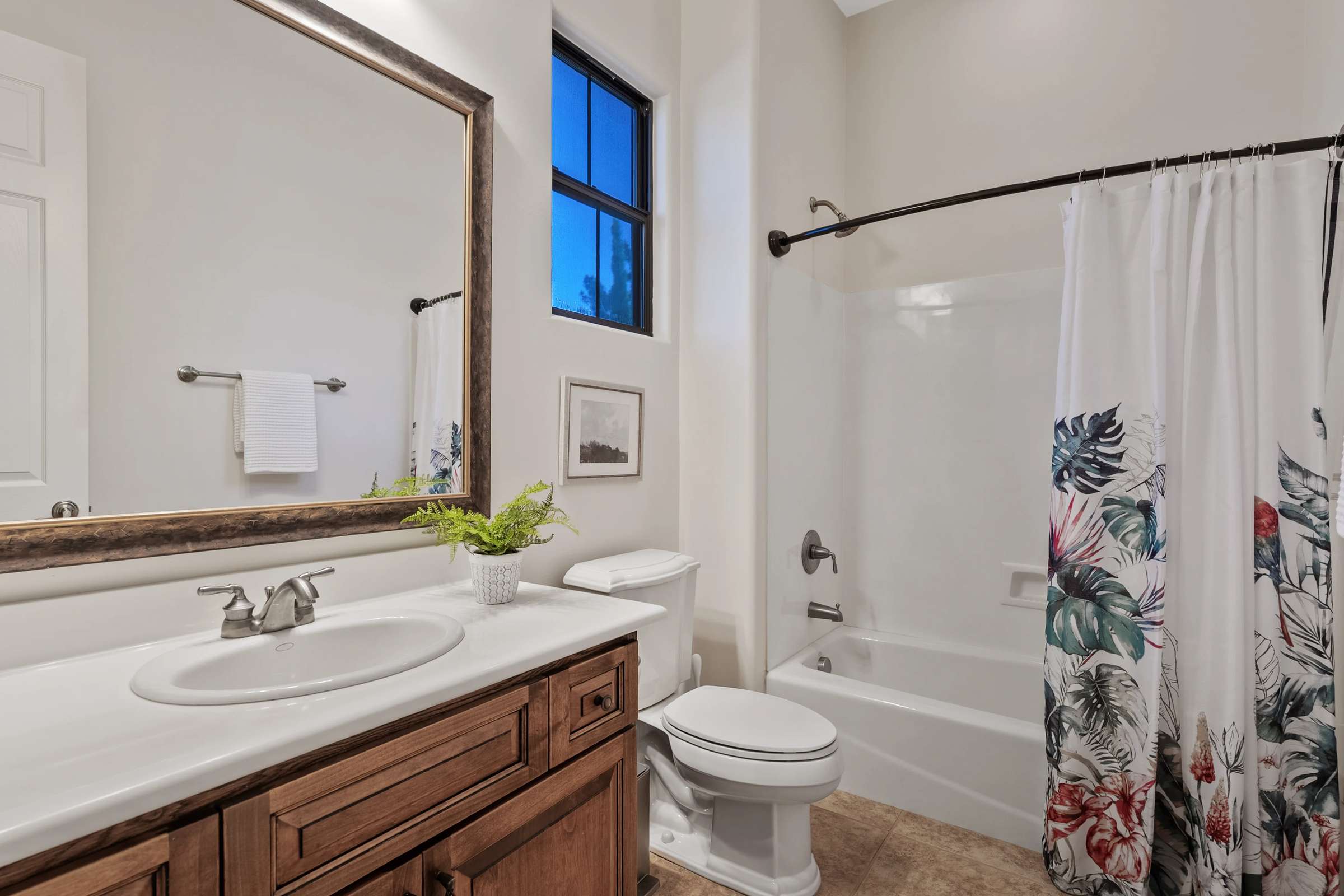 38 of 72. This well-designed full bathroom includes a spacious vanity, tub and shower combination, oversized mirror, and quality finishes that provide comfort and convenience for family and guests.