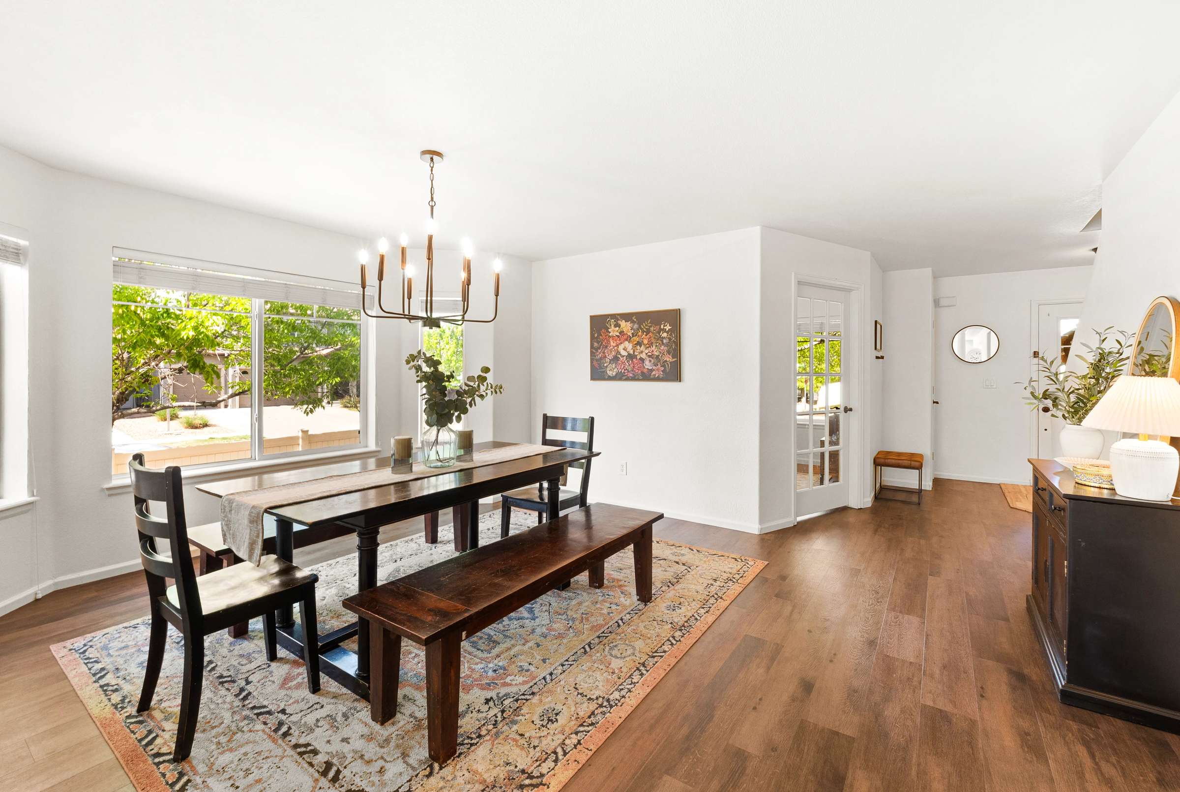 10 of 51. Natural light flows into the main level from the thoughtfully designed window bump out in the dining area.
