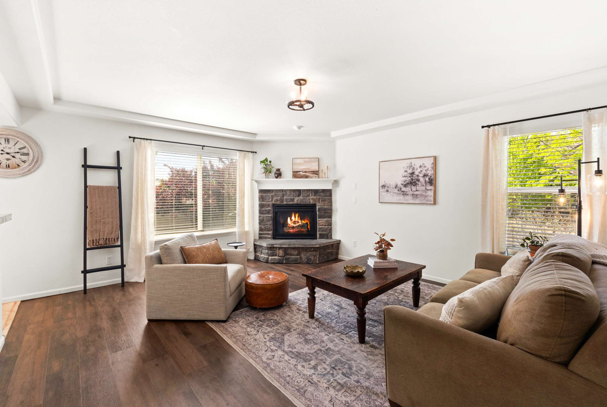 7 of 51. A welcoming living room is centered around a cozy gas fireplace.