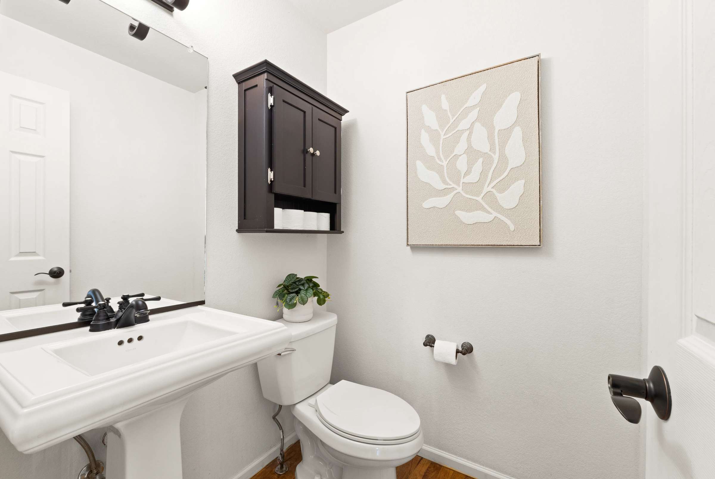 20 of 51. A half bathroom is located on the main level, perfect for guests.