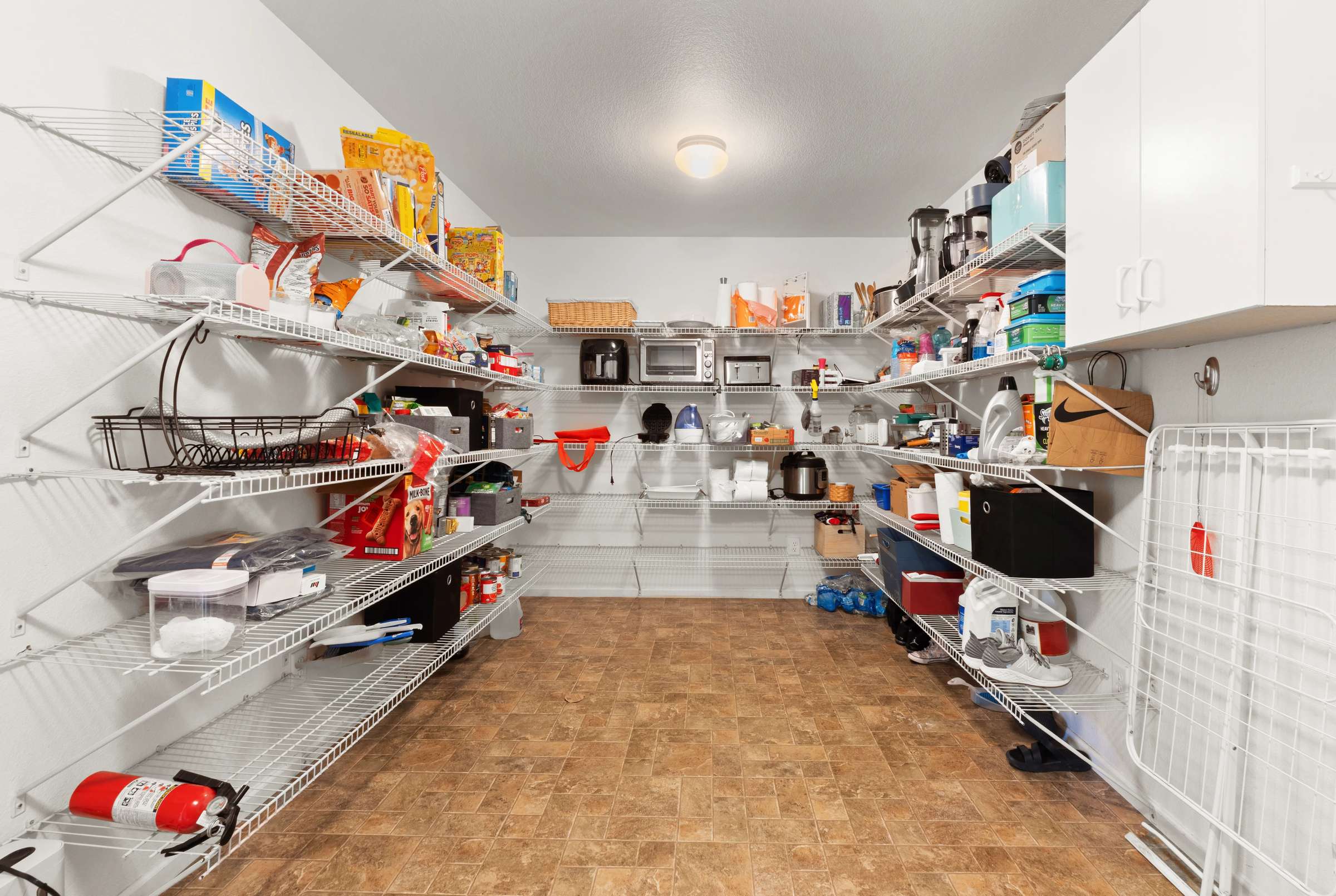 22 of 51. A massive pantry is located conveniently off the garage, making Costco hauls a breeze.