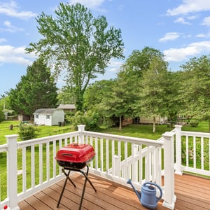 Enjoy outdoor living on this spacious deck, perfect for grilling and soaking in scenic views. This deck features a retractable awning, perfect for all seasons and all weather!