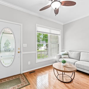 Bright and inviting living space with natural light and modern finishes, perfect for relaxation and entertaining.