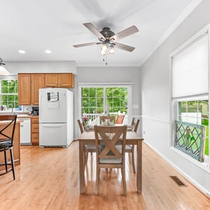 Bright and inviting kitchen-dining area features ample space and natural light for family gatherings.