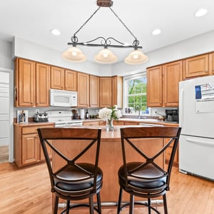 Bright and inviting kitchen featuring ample cabinetry, a spacious island, and modern appliances for effortless cooking.