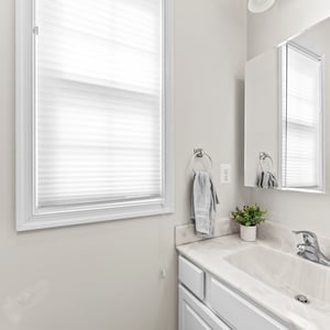 Bright bathroom featuring clean lines, modern fixtures, and ample natural light for a refreshing ambiance.