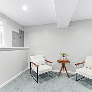Bright and welcoming space featuring comfortable seating, perfect for relaxation or casual gatherings.