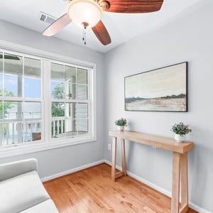 Bright and inviting room with large windows, natural light, and a cozy atmosphere perfect for relaxation.
