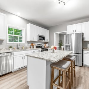 Modern kitchen featuring ample counter space, stainless steel appliances, and a bright, functional layout.