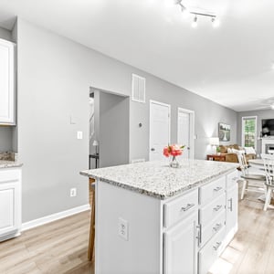 Bright and open kitchen flows into a welcoming dining area, perfect for gatherings and daily meals.