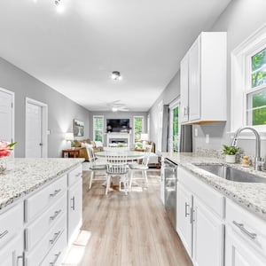 Bright and spacious open-concept kitchen flows seamlessly into the living area, ideal for modern living.