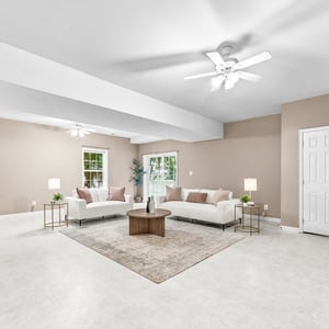Spacious living area featuring abundant natural light, perfect for entertaining and family gatherings.