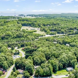 Discover a spacious, tree-filled landscape perfect for this amazing home and enjoying nature's tranquility.