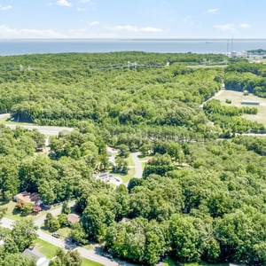 Discover expansive wooded lots with close proximity to the shoreline and convenient access to local amenities.