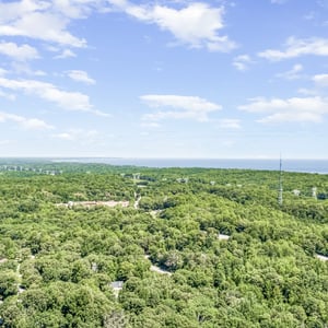 Discover expansive wooded land with breathtaking views, perfect for this home.
