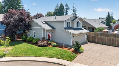 This well-maintained home features a spacious yard and convenient cul-de-sac location, perfect for families.