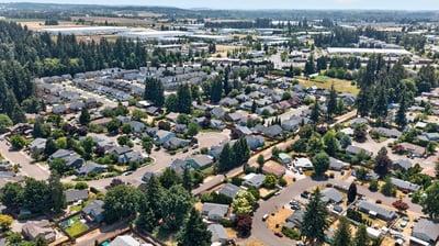Spacious suburban community featuring tree-lined streets, diverse housing options, and abundant green spaces.