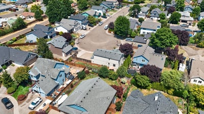 Spacious homes on tree-lined streets, showcasing a vibrant community and convenient access to amenities.