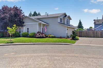 This well-maintained home features vibrant landscaping and ample outdoor space in a quiet cul-de-sac.