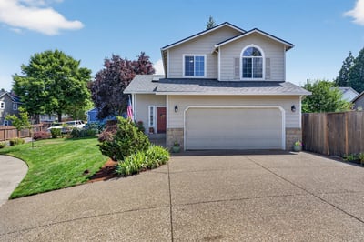 This well-maintained home features a spacious yard and ample parking, perfect for family gatherings and outdoor activities.