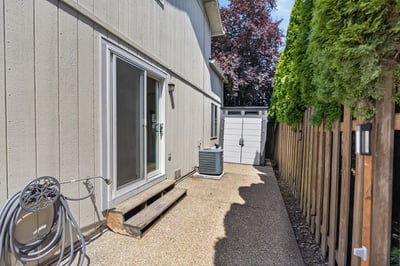 This low-maintenance outdoor space features gravel flooring, landscaping potential, and easy access to utilities.