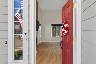 Step into this inviting entryway, showcasing an open layout and abundant natural light throughout.