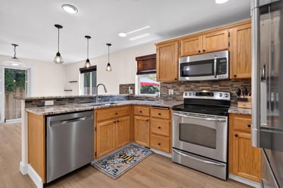 Bright and functional kitchen featuring modern appliances and ample counter space, perfect for everyday cooking.