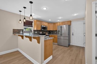 Modern kitchen with updated appliances, beautiful cabinetry, and inviting layout perfect for entertaining and cooking.
