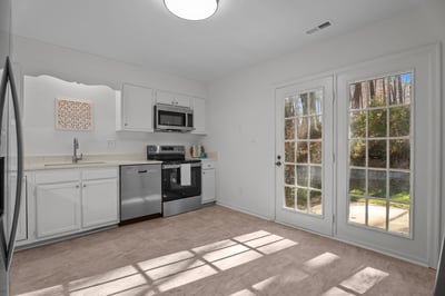 Kitchen includes painted cabinets and brand new stainless steel appliances