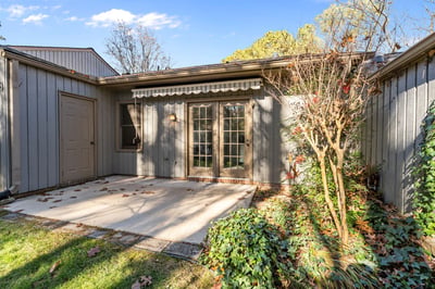 Rear patio with retractable awning and storage closet