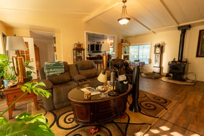 LIVING ROOM WITH HIGH CEILING, WOOD-STOVE, LAMINATE FLOORING