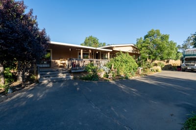 FRONT OF HOUSE WITH DECK